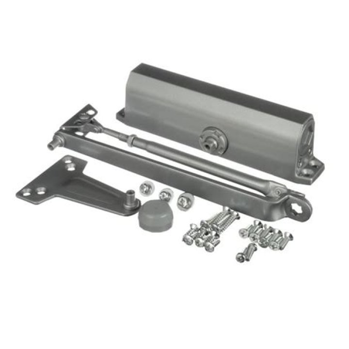 Super compact piston door with button and pressure plate